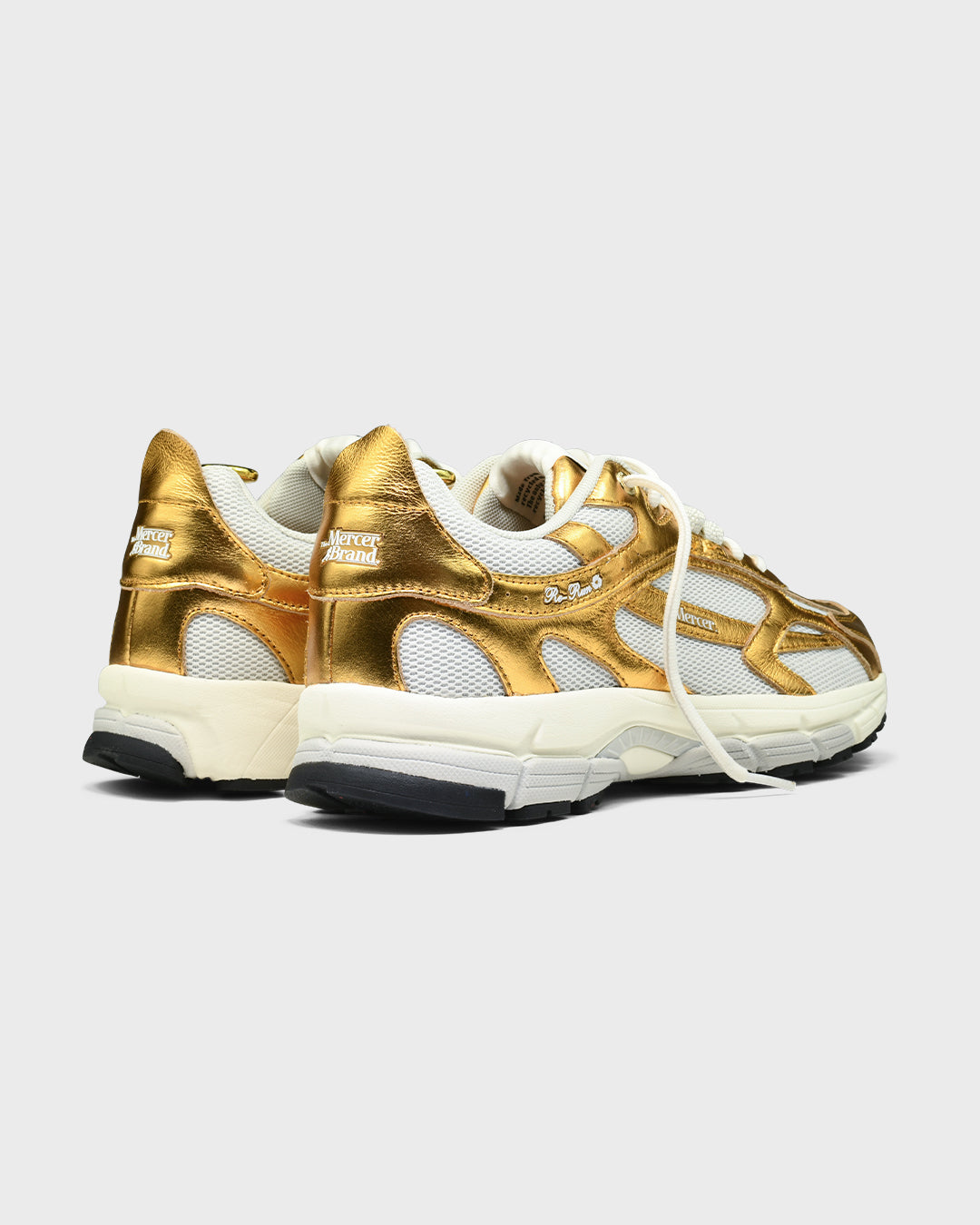 the mercer brand sneaker the re-run pine gold with off white details for women 