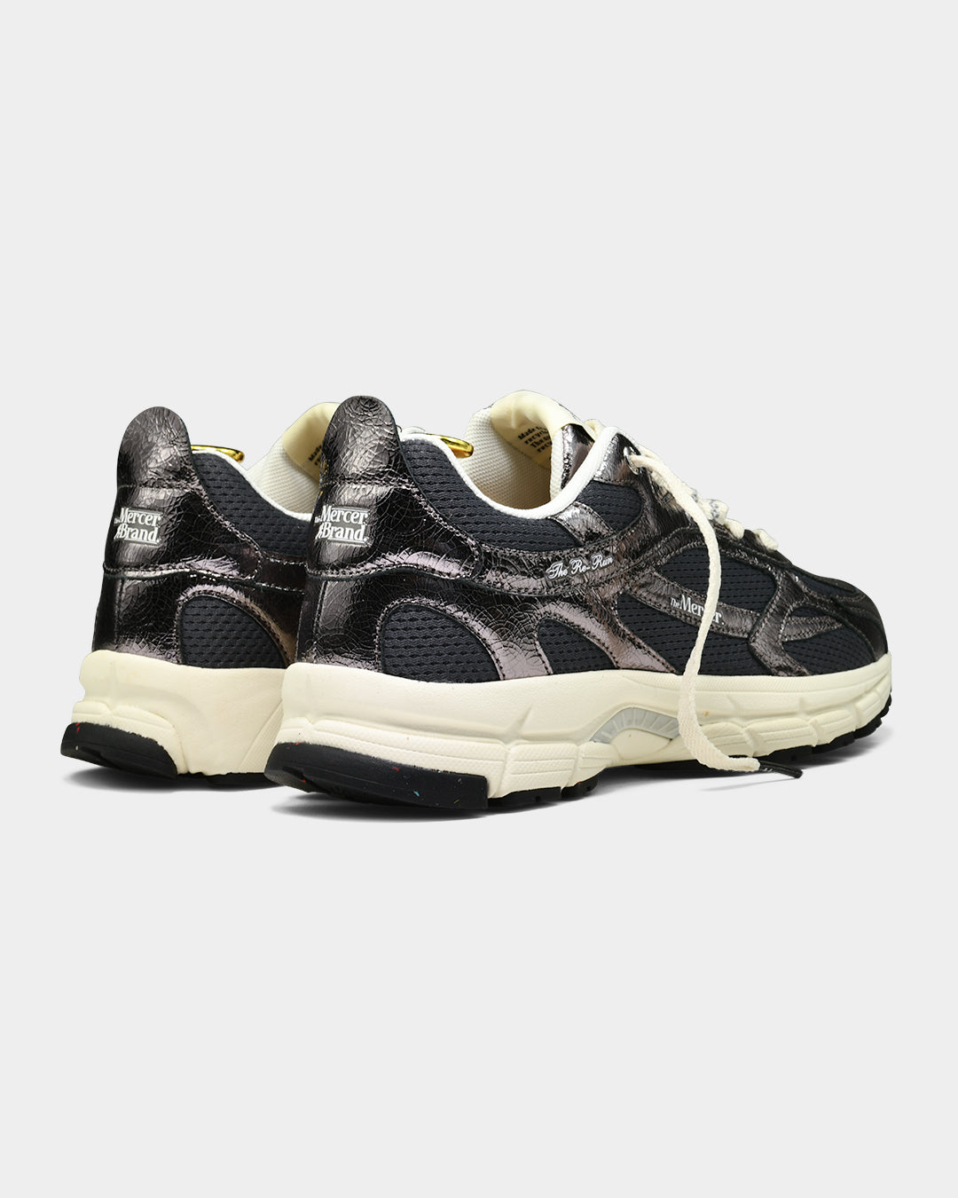 the mercer brand sneaker the re-run cracked anthracite dark grey with shiny details and off white outsole 