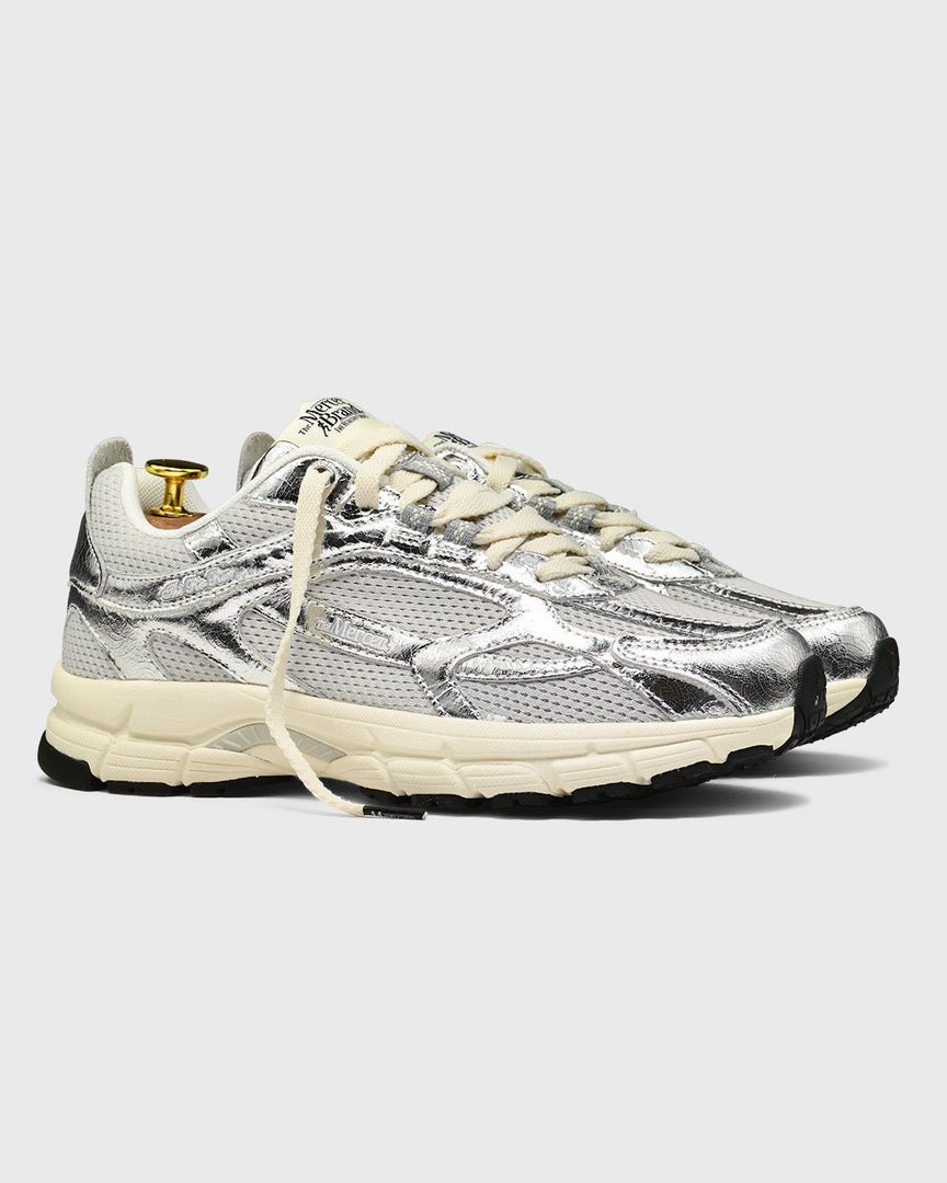 the mercer brand sneaker the re-run cracked silver with off white outsole