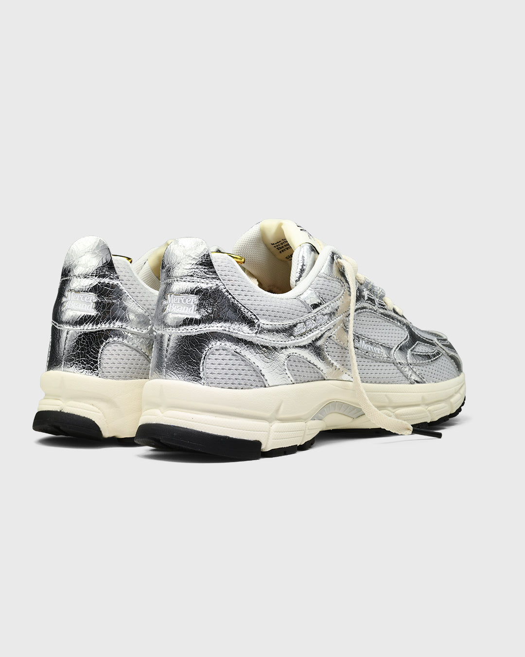 the mercer brand sneaker the re-run cracked silver with off white outsole