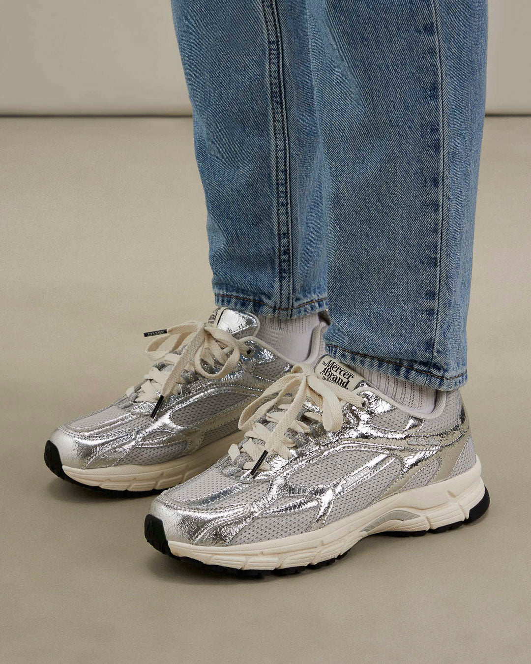 the mercer brand sneaker the re-run cracked silver with off white outsole