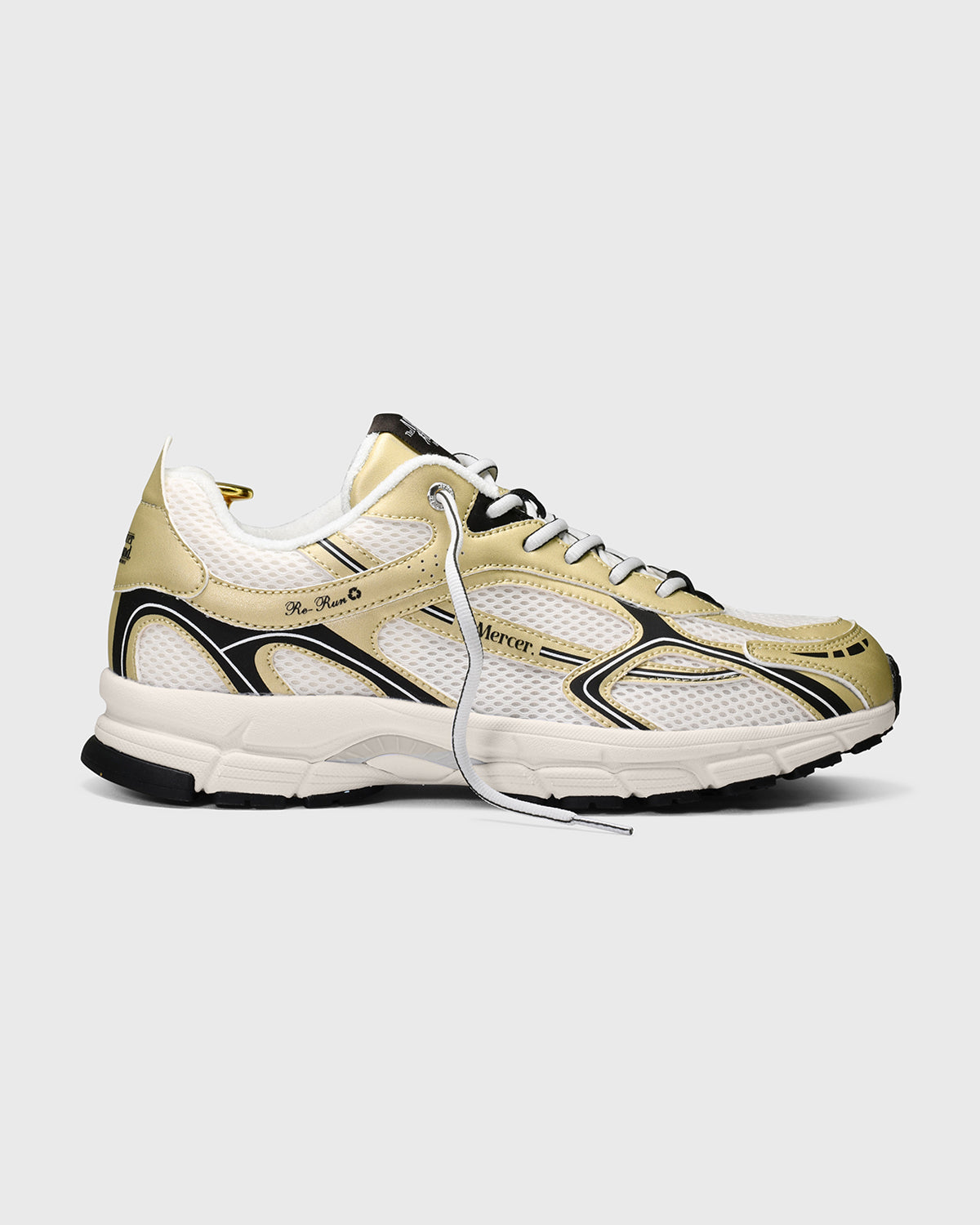 The Mercer Brand re-run sneaker speed gold with black details product photo side
