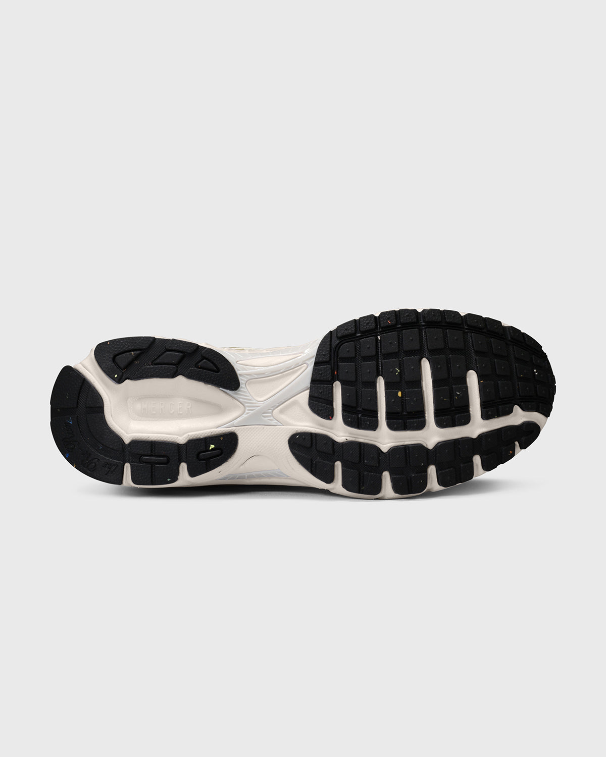 The Mercer Brand re-run sneaker speed gold with black details product photo outsole made from recycled rubber 