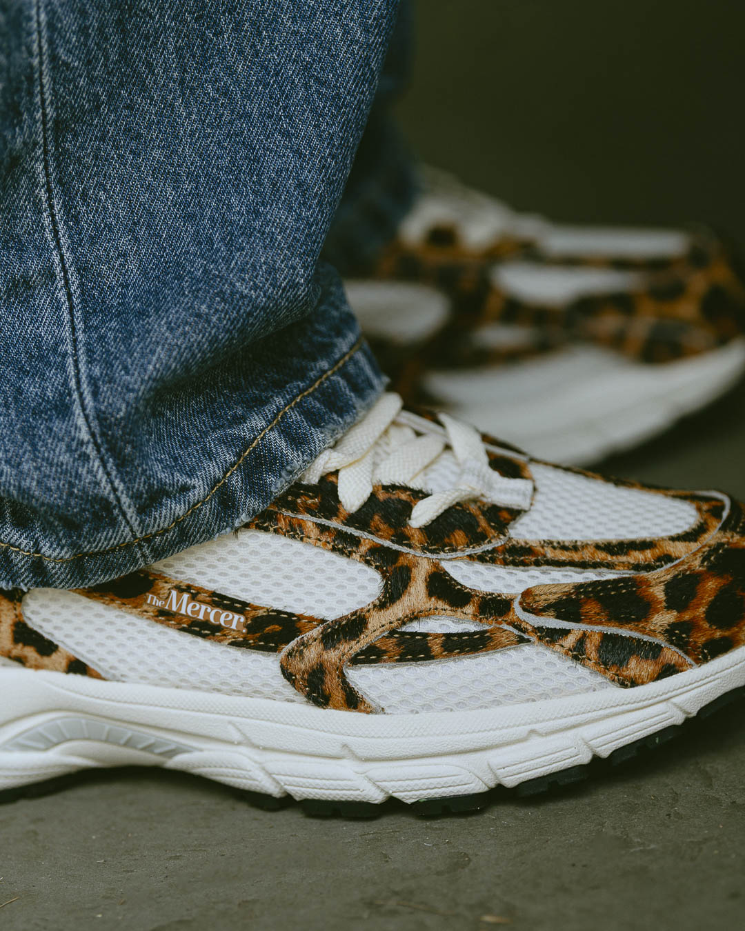 the mercer brand sneaker the re-run leopard with off white mesh and outsole
