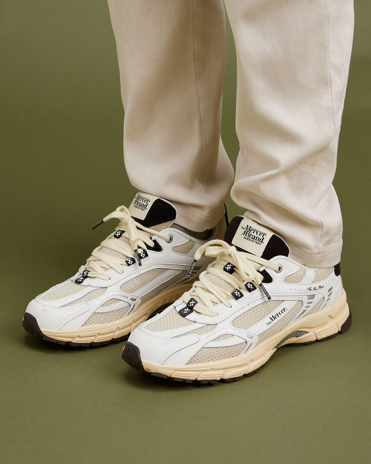 The Mercer Brand re-run sneaker vintage with brown details and off white sole on foot 