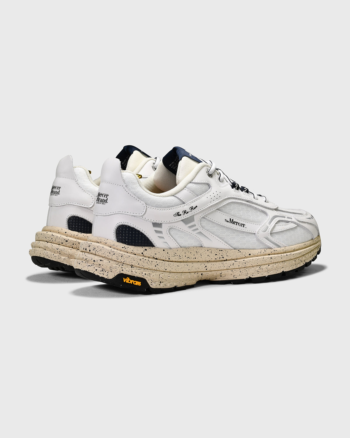 the mercer brand sneaker the re-run Vibram white with off white sole and navy details 