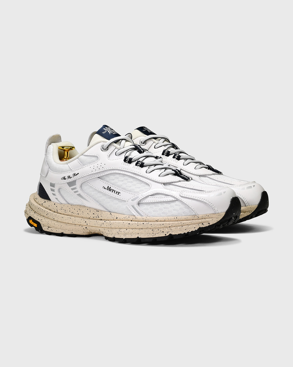 the mercer brand sneaker the re-run Vibram white with off white sole and navy details 
