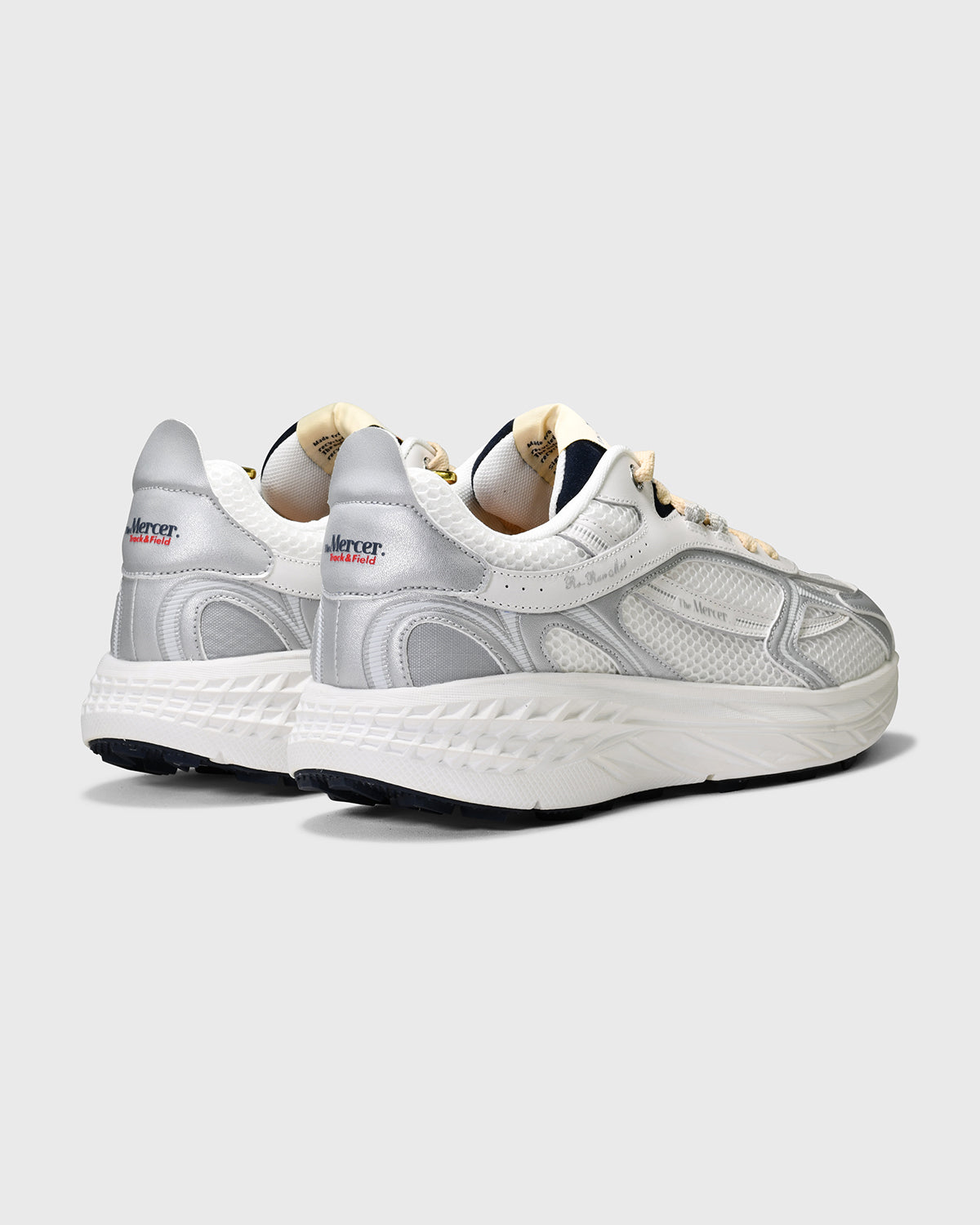the mercer brand re-run max sneaker track and field white sneaker with cream laces and small navy details 