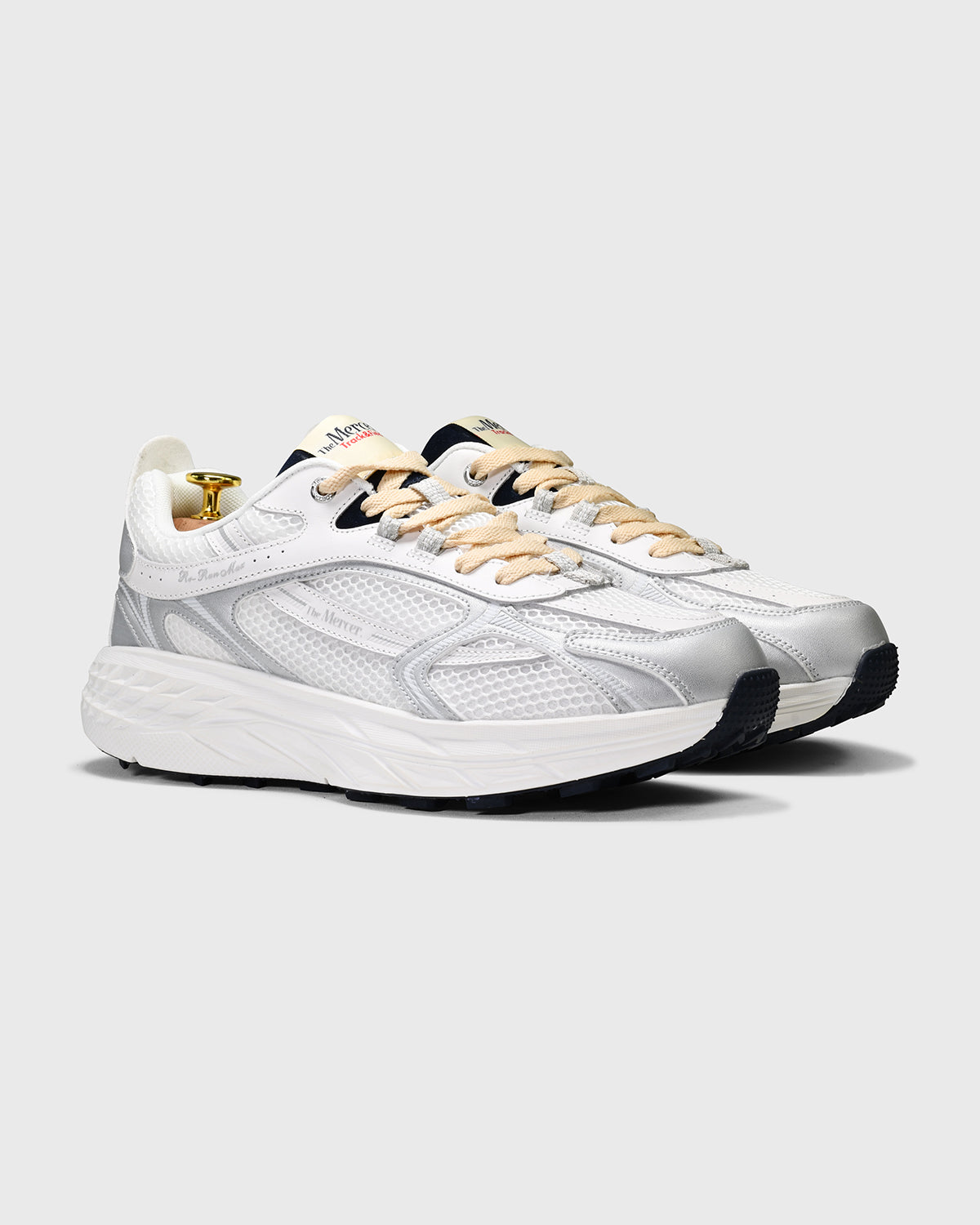 the mercer brand re-run max sneaker track and field white sneaker with cream laces and small navy details 