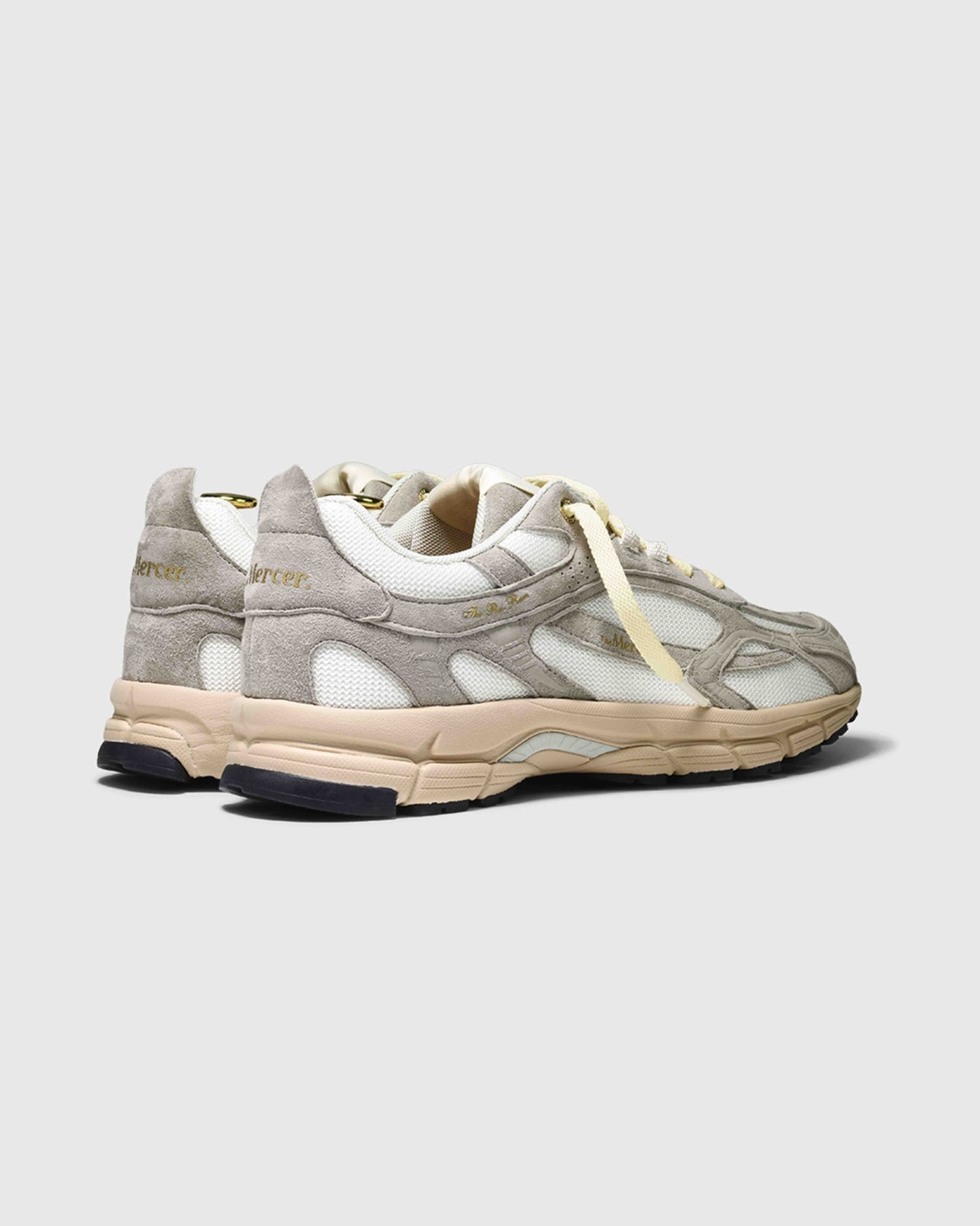 Product photo taken from an angle of the back showing The Re-Run  Desert 2.0 in sand.