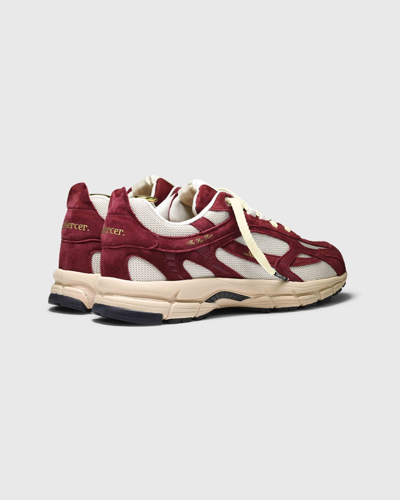 Product photo taken from an angle of the back showing The Re-Run Desert 2.0 in bordeaux.