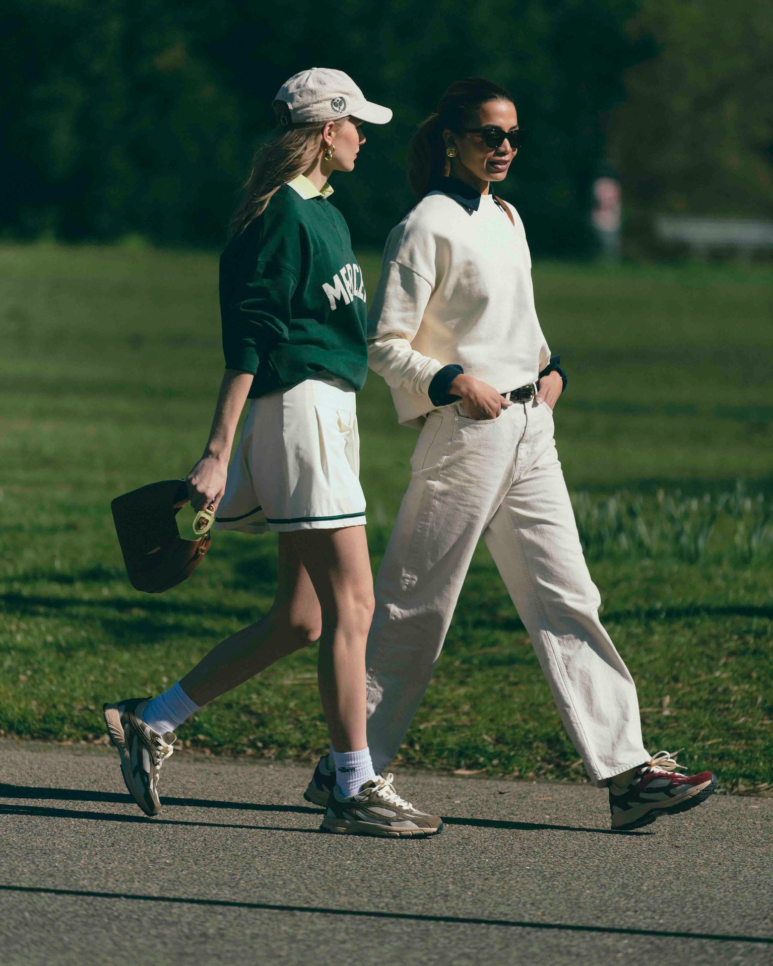 Two women are both wearing The Re-Run Desert 2.0 in bordeaux and in brown. Also they both are wearing a Mercer Sweater.