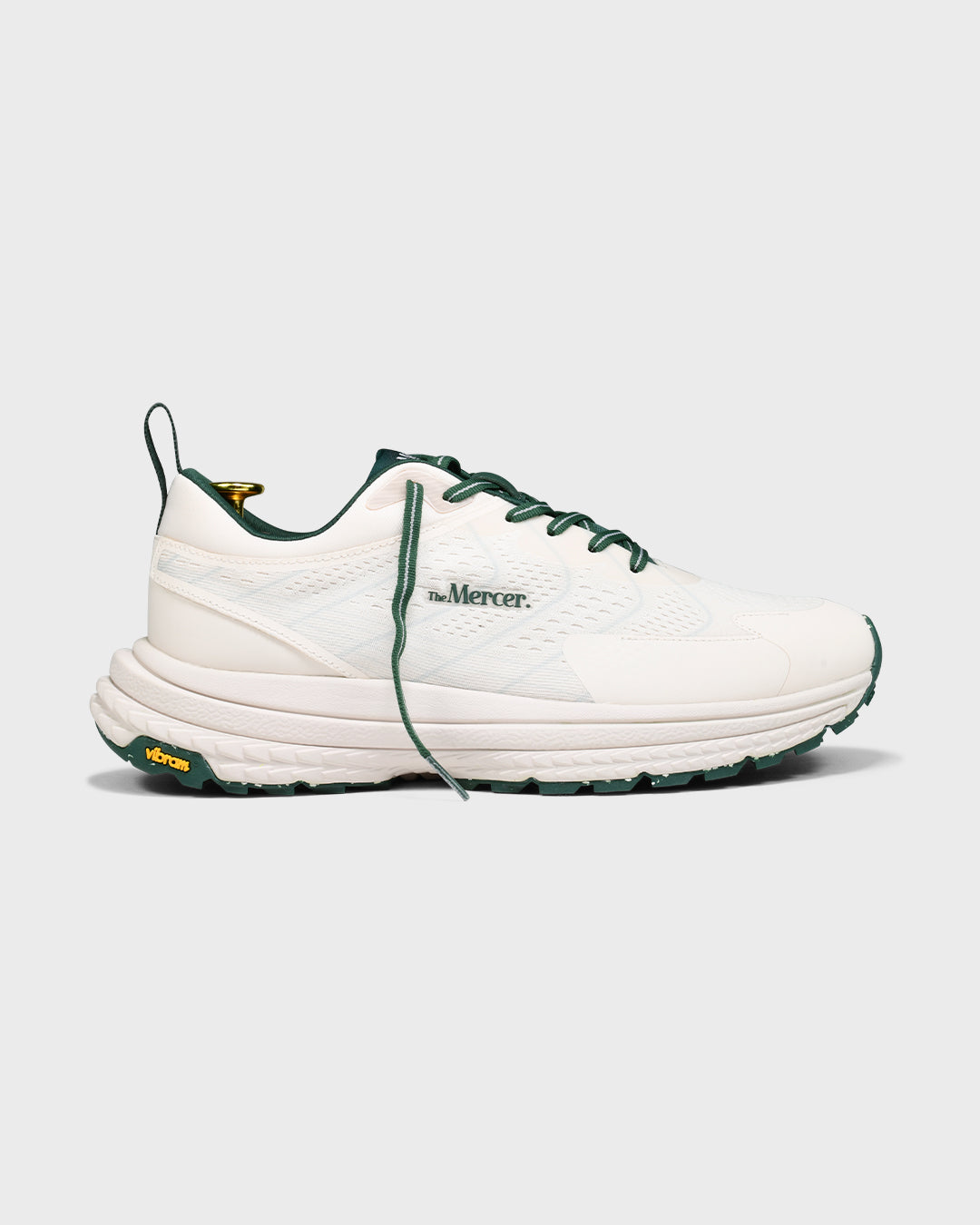 Sideview of The Mercer P22 in white/green showing the Vibram sole.