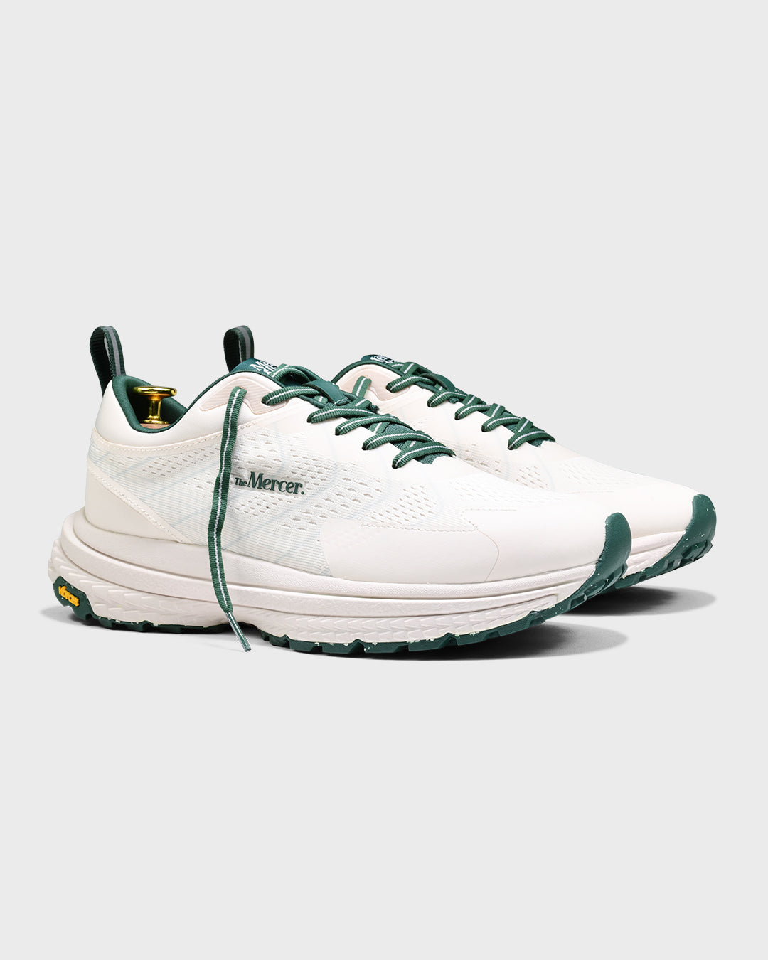 Sideview of The Mercer P22 in white/green showing the Vibram sole.