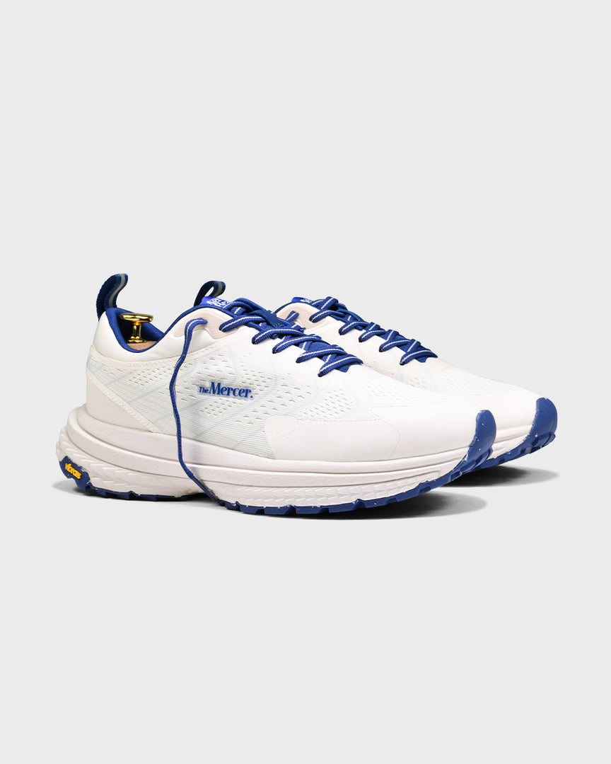 Sideview of The Mercer P22 in white/blue