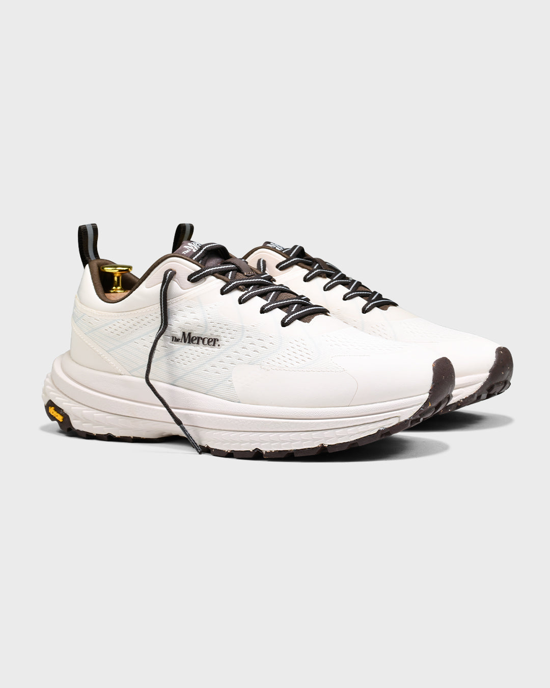 Product sideview of The Mercer P22 in white/brown showing the Vibram sole.