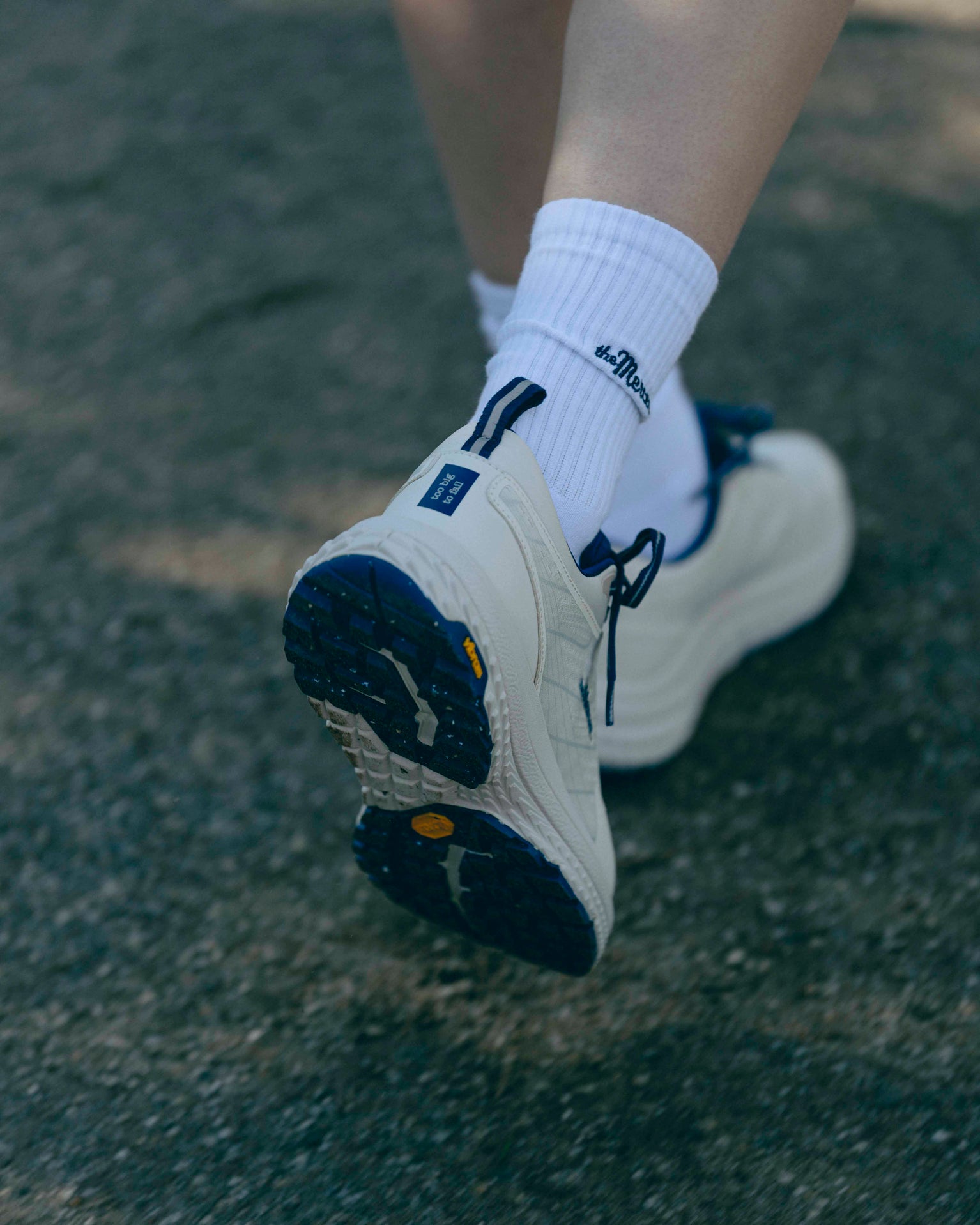 Close up of The Mercer P22 showing the bottom of the Vibram sole and the matching MercerSocks in white.