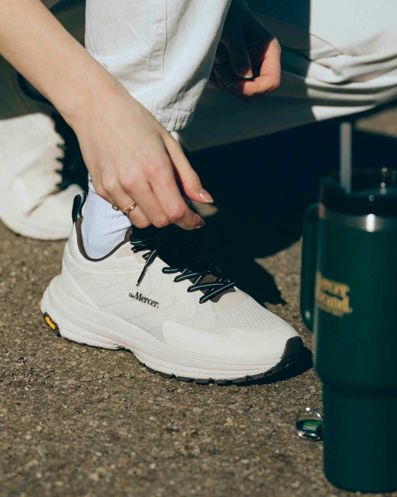 Product sideview of The Mercer P22 in white/brown showing the Vibram sole.