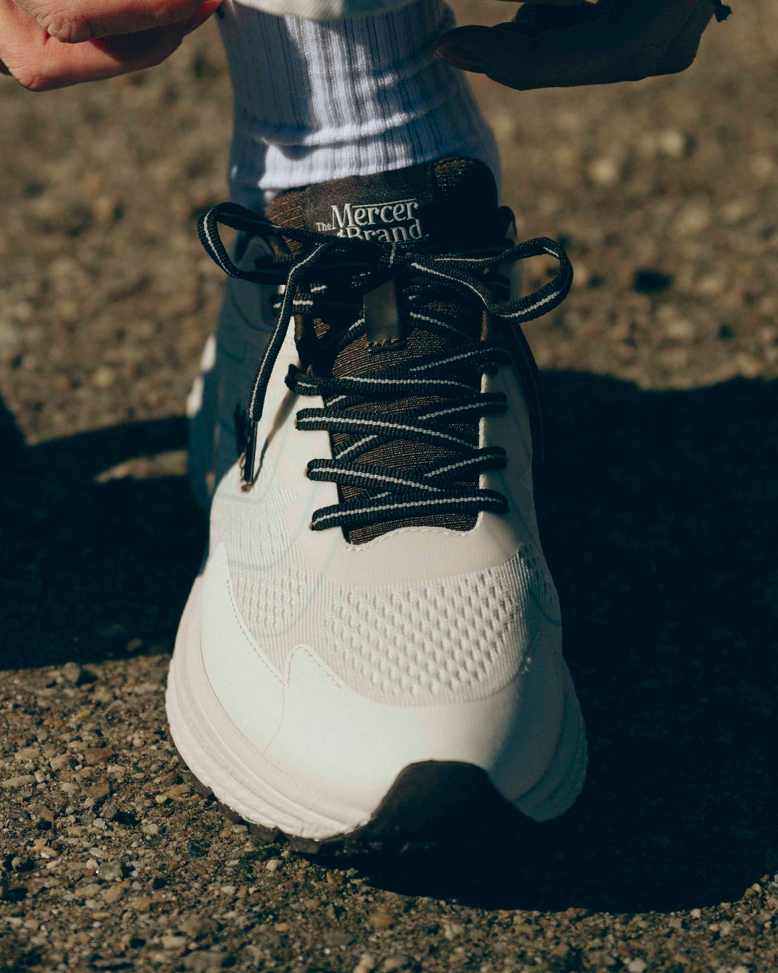 Product sideview of The Mercer P22 in white/brown showing the Vibram sole.