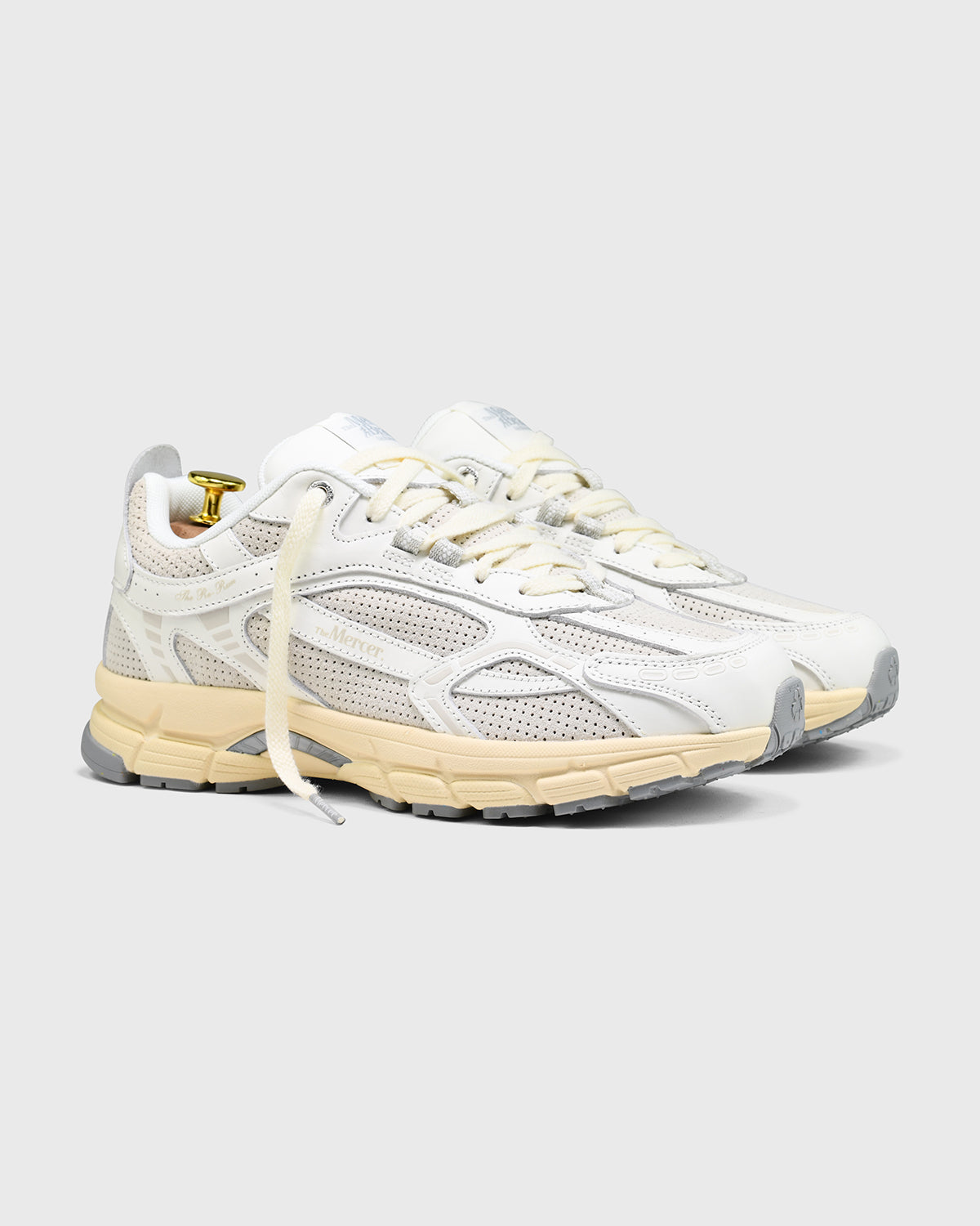 the mercer brand re-run sneaker white with off white sole and perforated leather