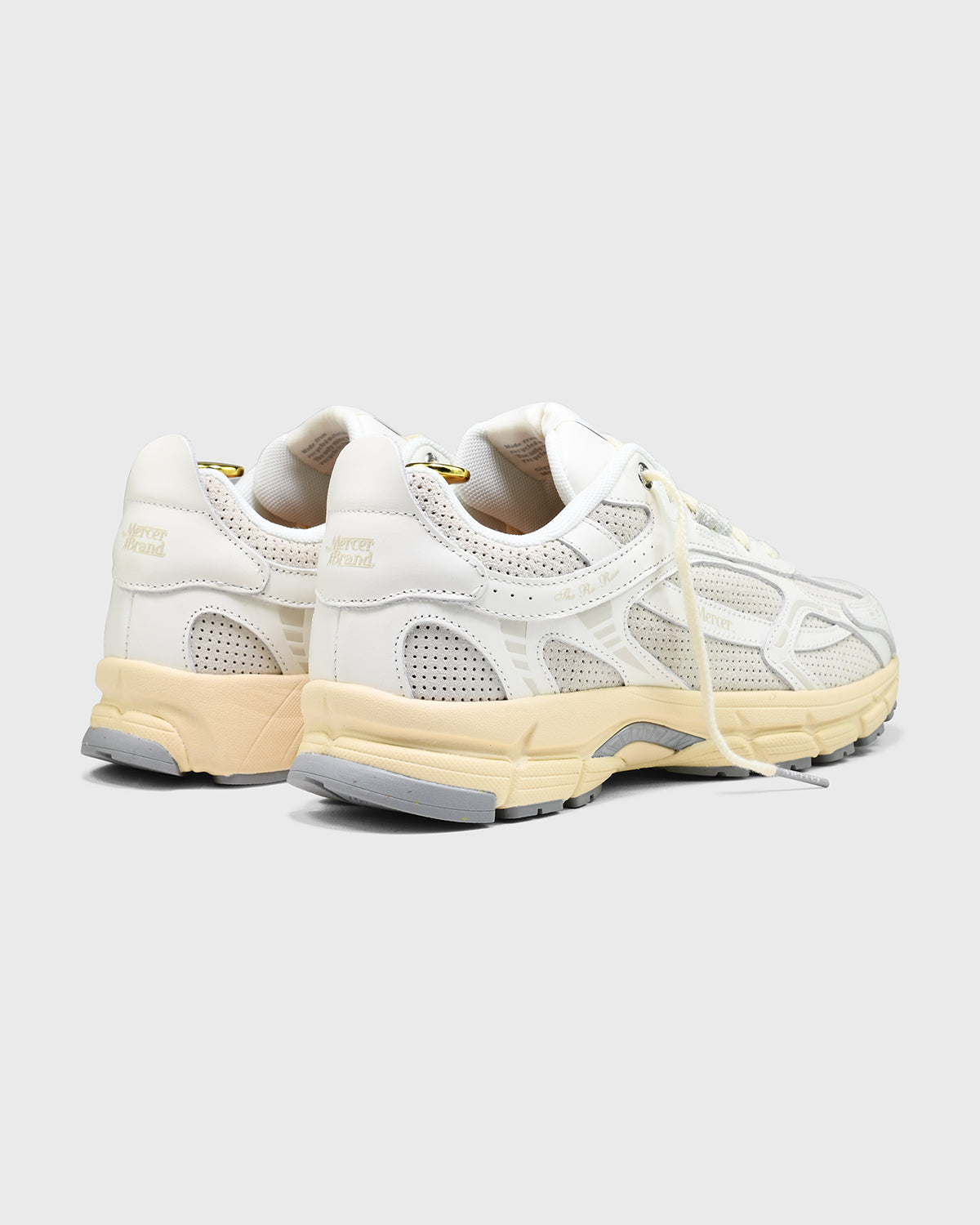 the mercer brand re-run sneaker white with off white sole and perforated leather
