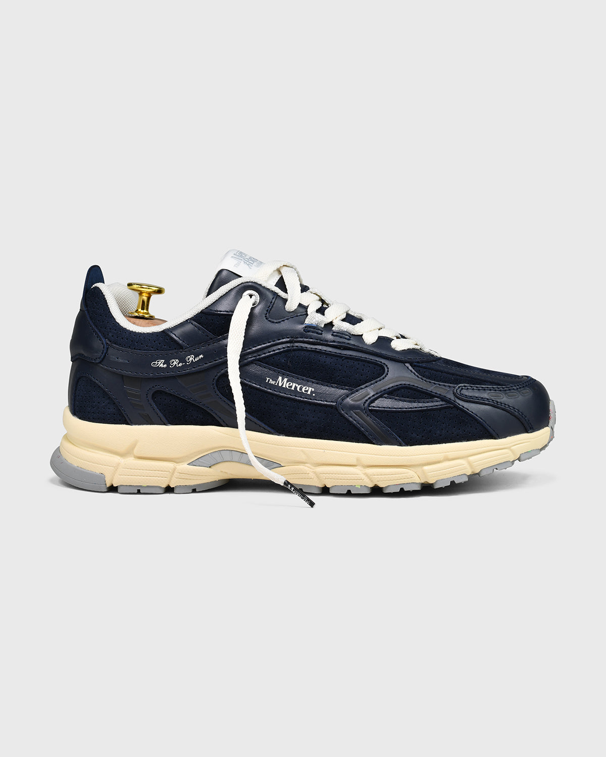 the mercer brand sneaker the re-run perforated navy with off white outsole