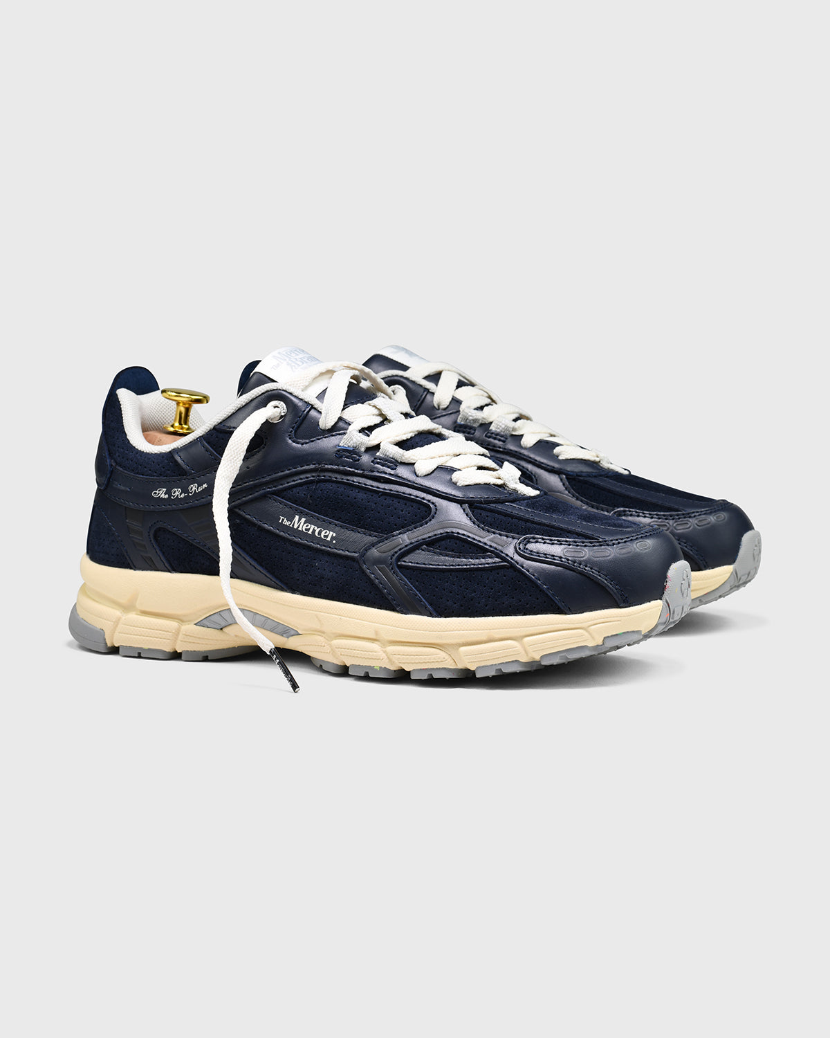 the mercer brand sneaker the re-run perforated navy with off white outsole