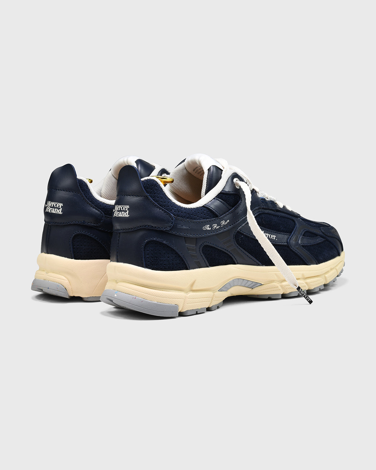 the mercer brand sneaker the re-run perforated navy with off white outsole
