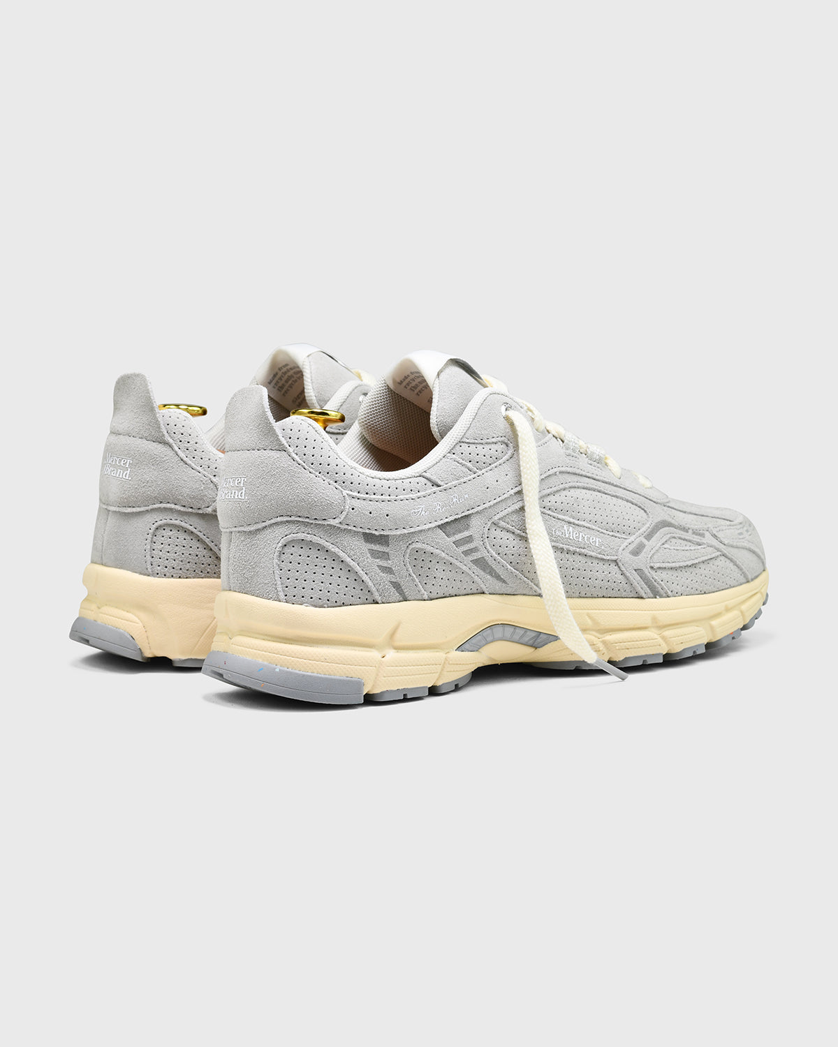 the mercer brand sneaker grey with off white sole and perforated leather 