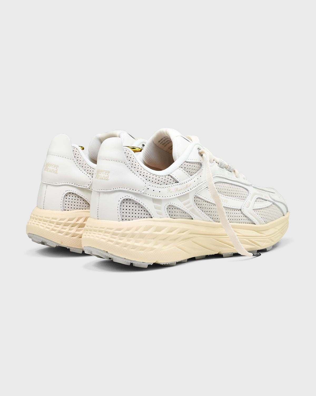 the mercer brand sneaker the re-run max white with perforated leather and off white outsole 