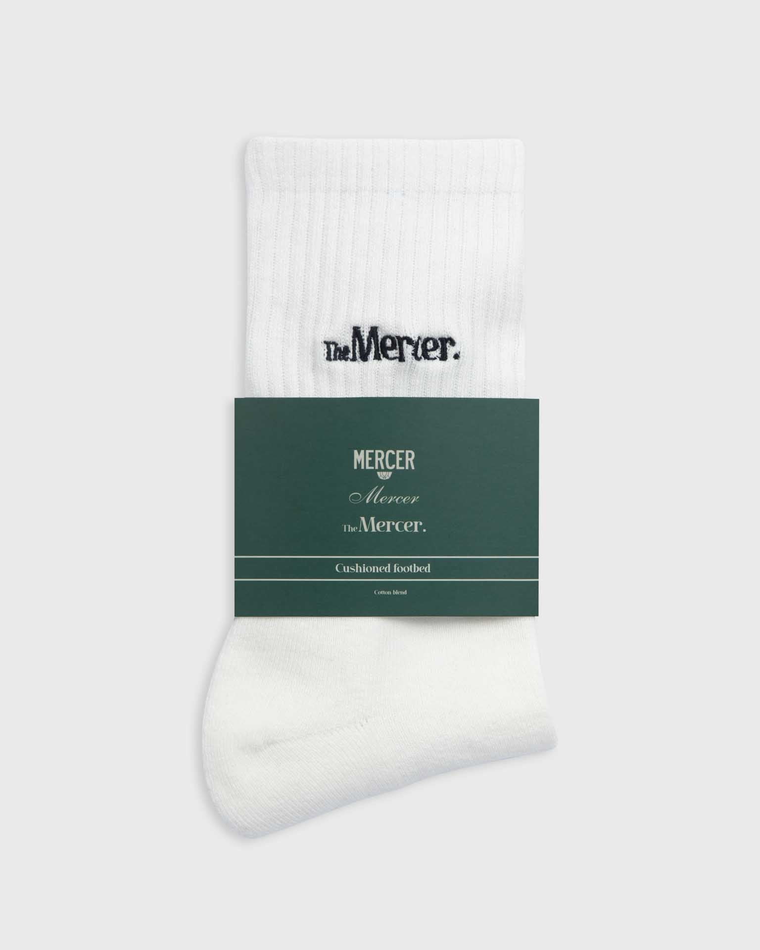the mercer brand socks white with navy lettering 