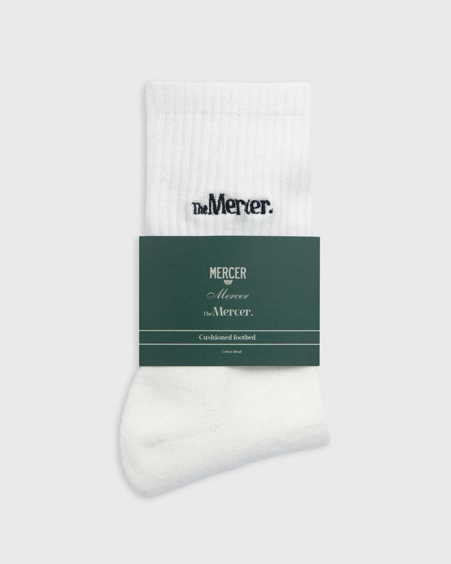 the mercer brand socks white with navy lettering 