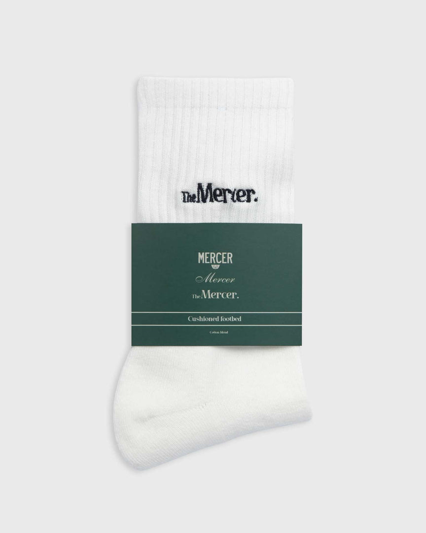 the mercer brand socks white with navy lettering 