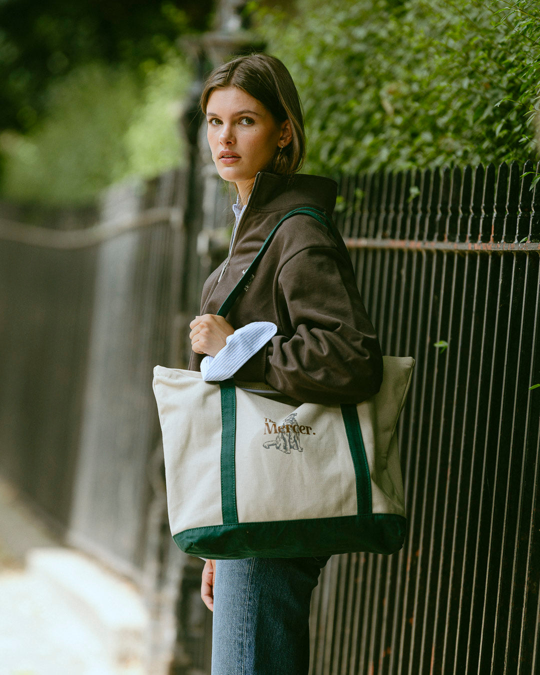 the mercer brand canvas bag with dog and green details 