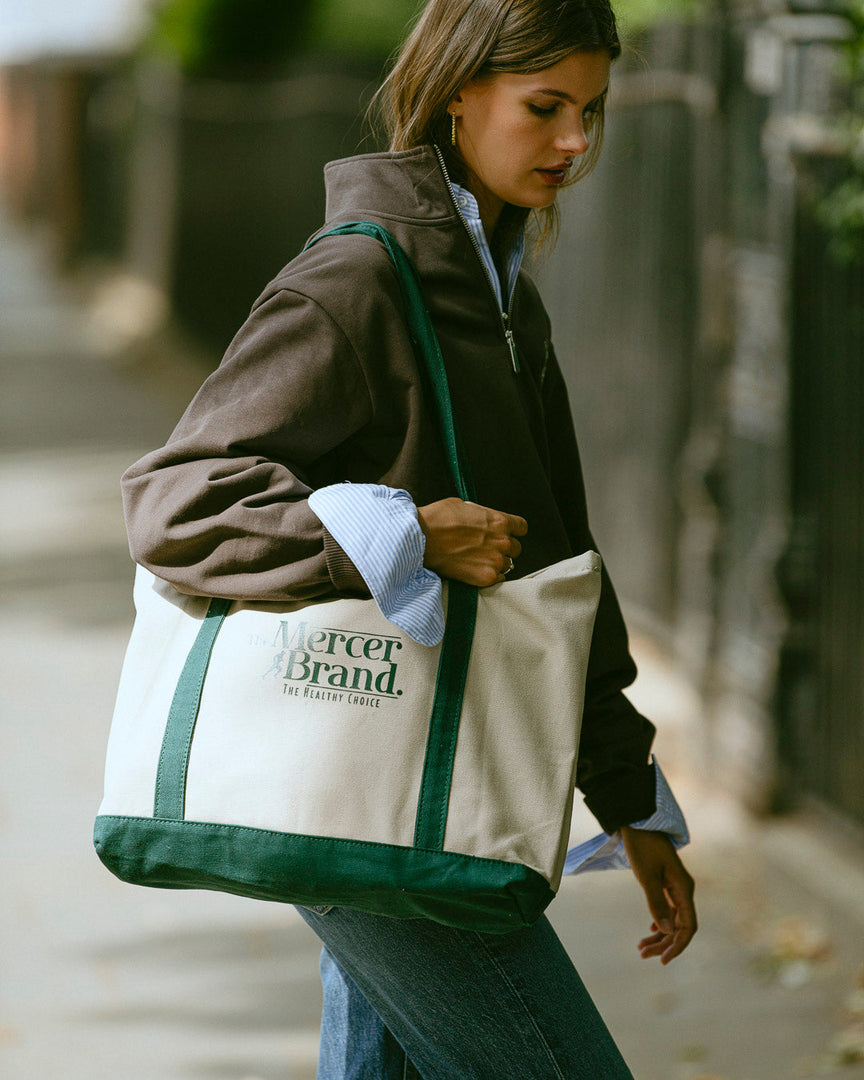the mercer brand canvas bag with dog and green details 