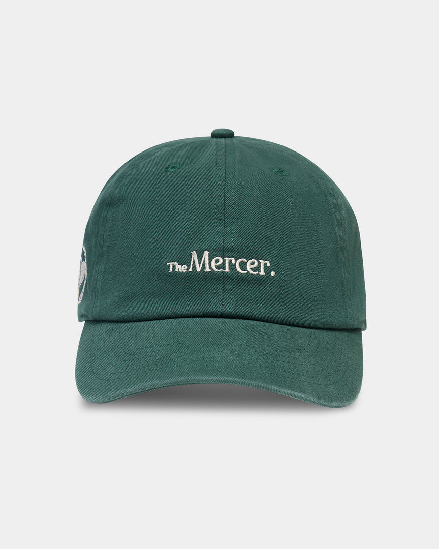 Product photo of the front of The Mercer Tennis Cap in green.