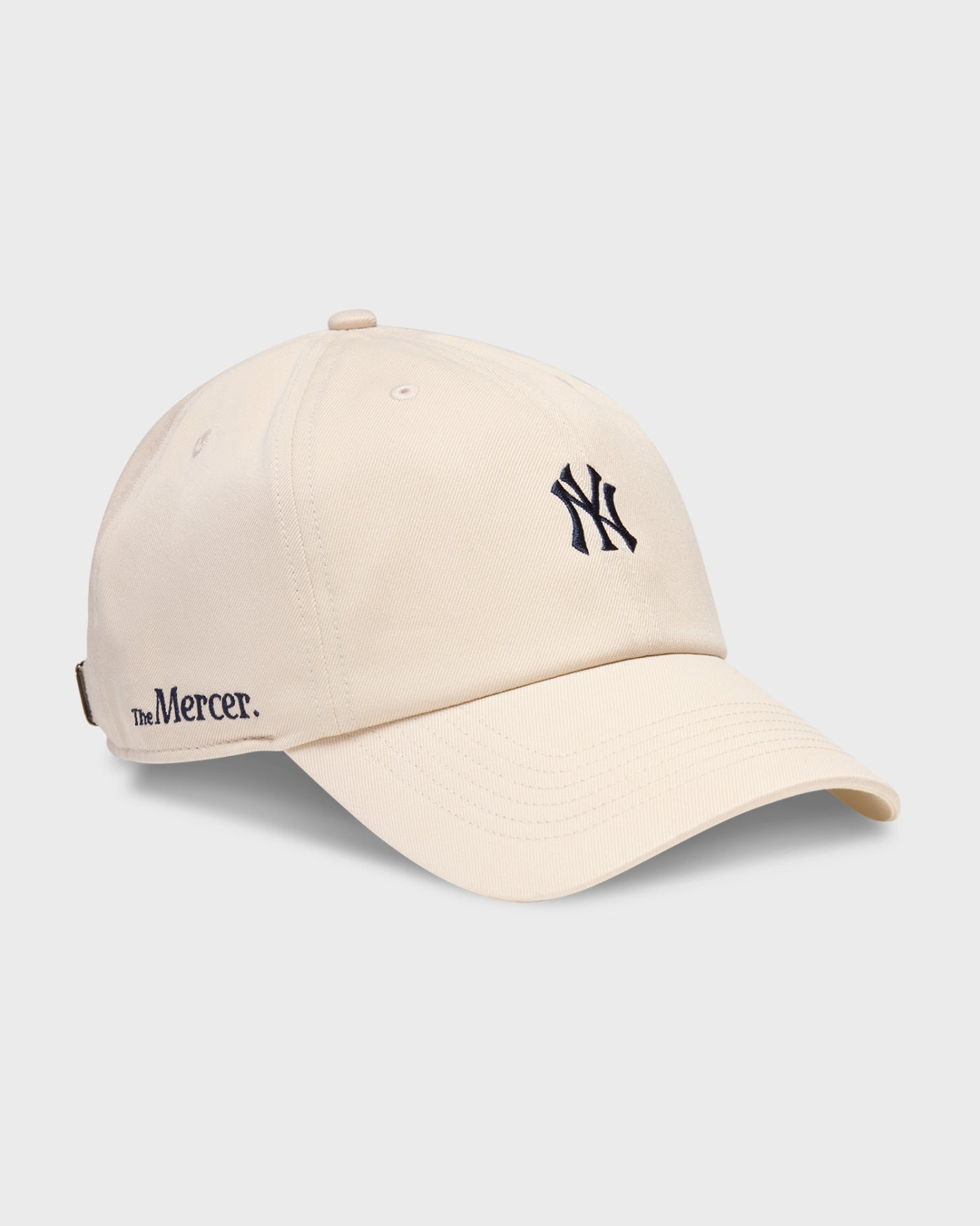 Product photo of the side of a The Mercer brand x New York Yankees x 47 cap in offwhite