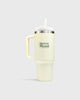 The Mercer Brand cream tumbler with logo on a light grey background