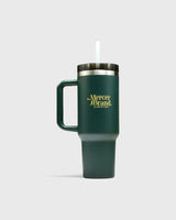 The Mercer Brand green tumbler with logo on light grey background
