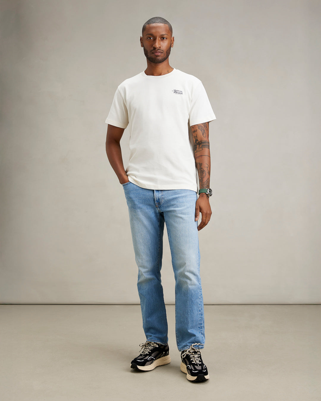 The mercer brand heavy tee off white product photo front with text 