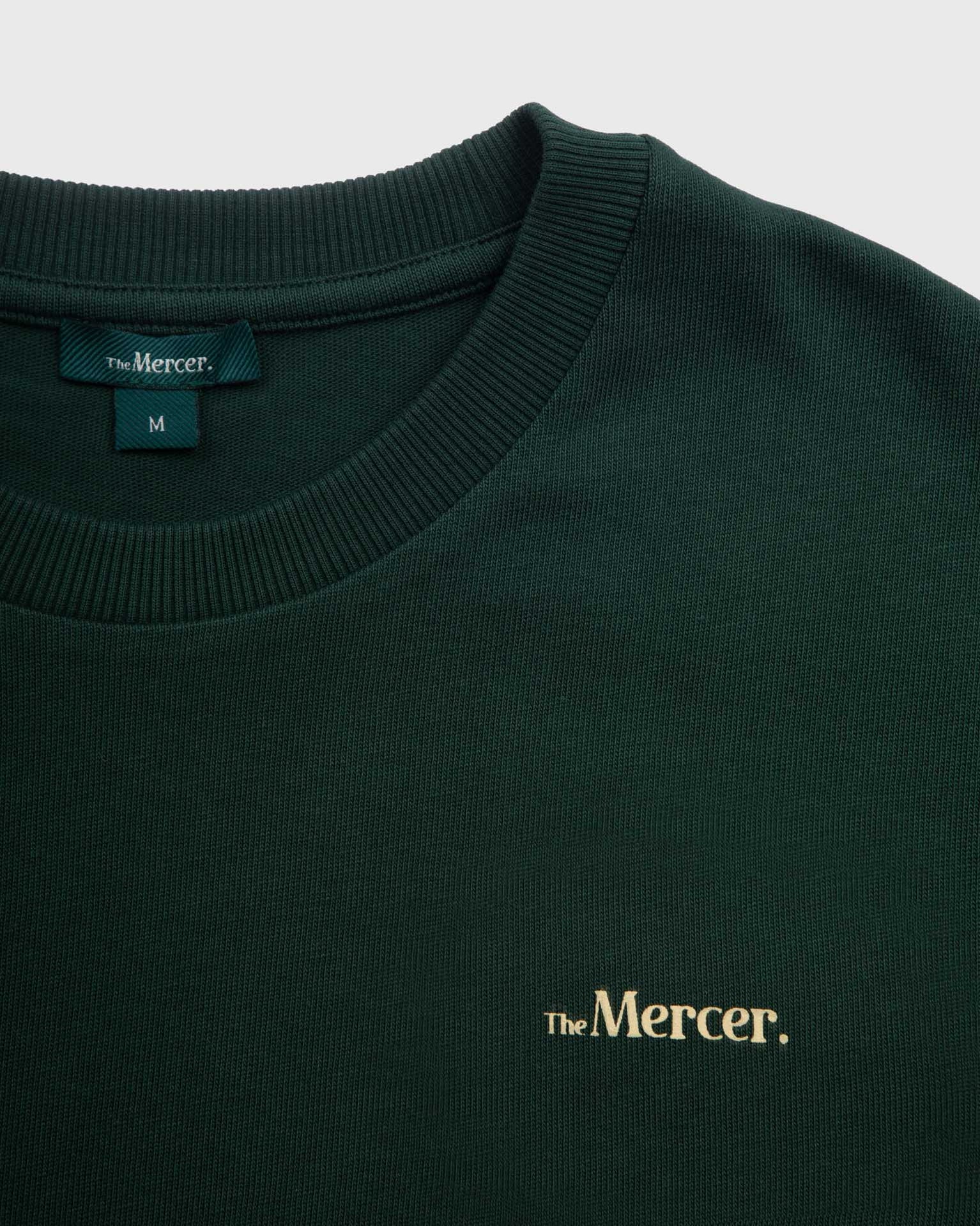 the mercer brand t shirt with small logo green