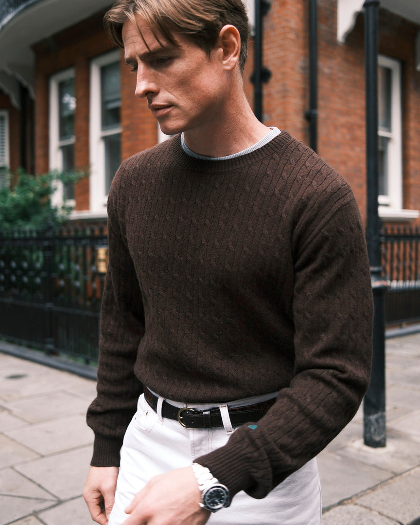the mercer brand cable knit made from cashmere in brown green logo on arm