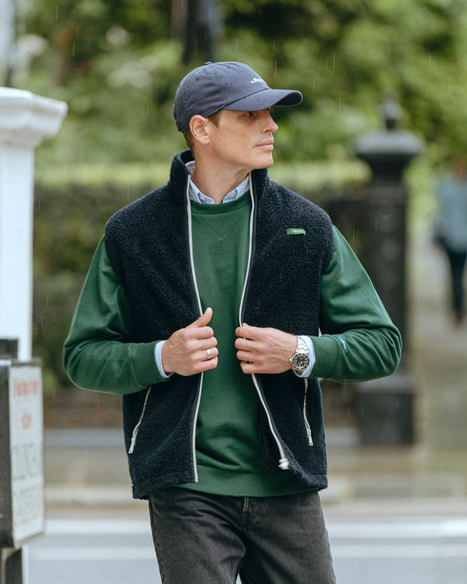 the mercer brand wool bodywarmer navy with green logo