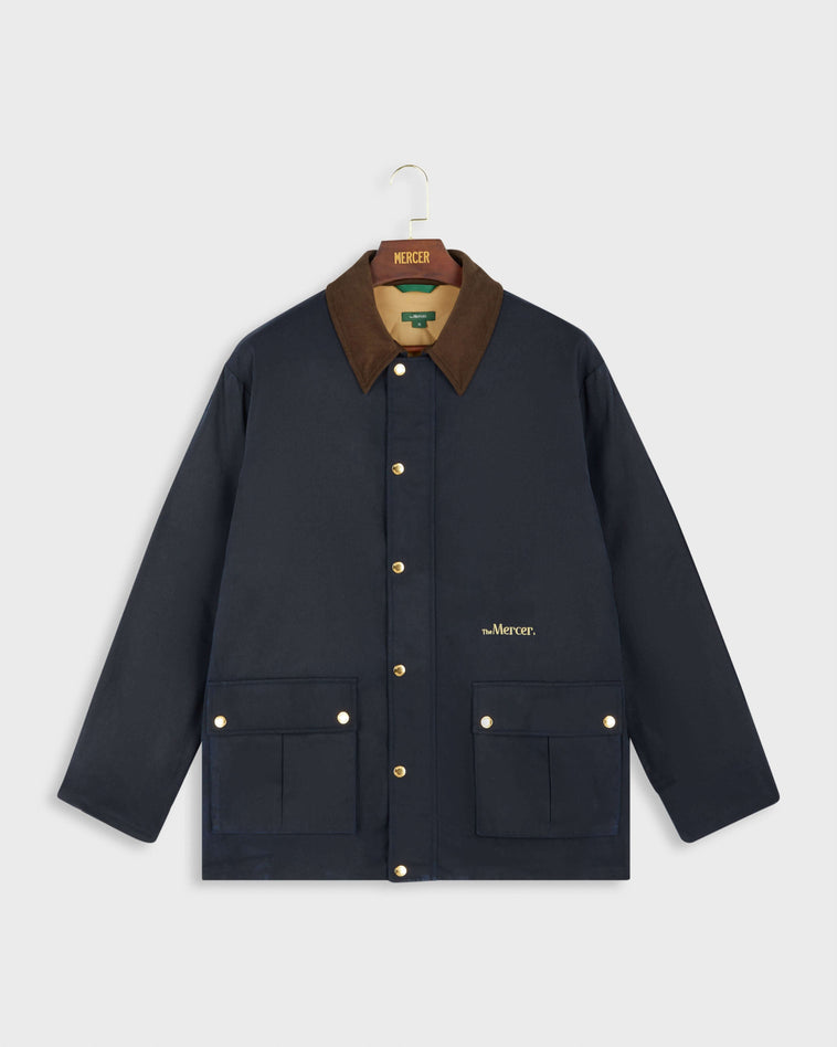 Front of the mercer brand navy subway jacket