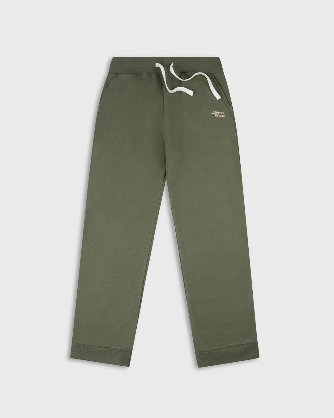 Green The Mercer Brand sweatpants with white drawstring on a light grey background