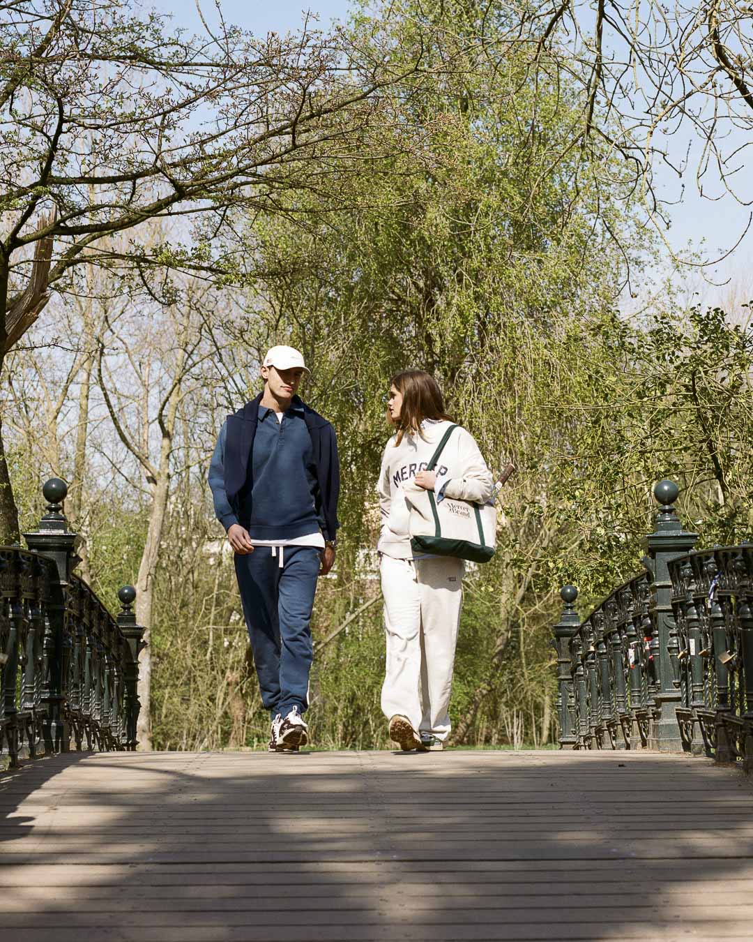 The Mercer Brand navy sweatpants with white drawstring on a light grey background