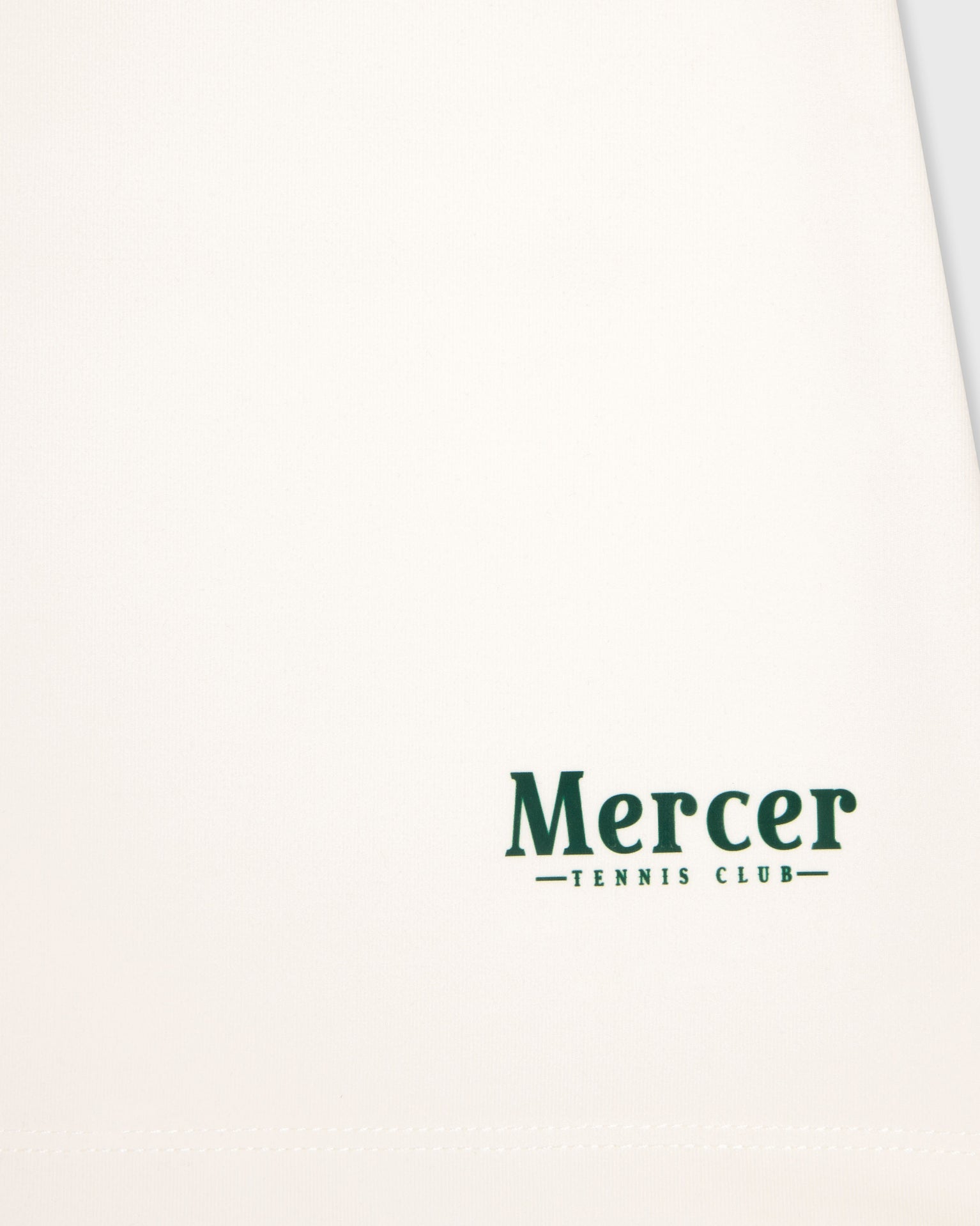 Close up of The Mercer Brand logo on The Mercer Tennis polo.