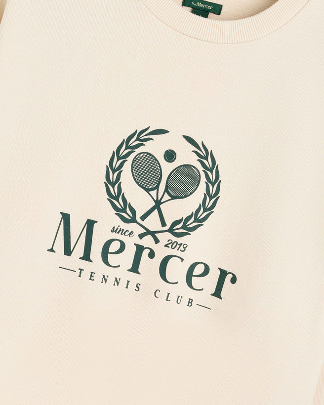 Product photo of the front of The Mercer Tennis Sweat in off white.