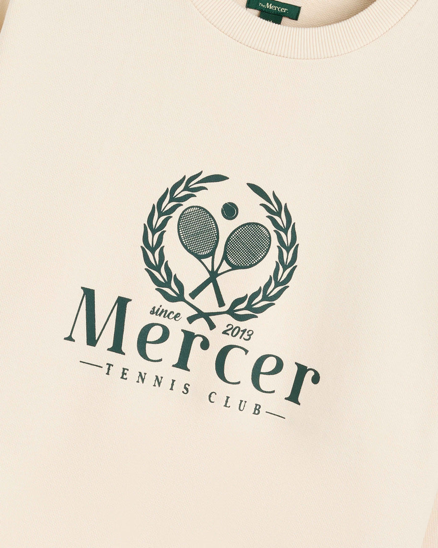 Product photo of the front of The Mercer Tennis Sweat in off white.