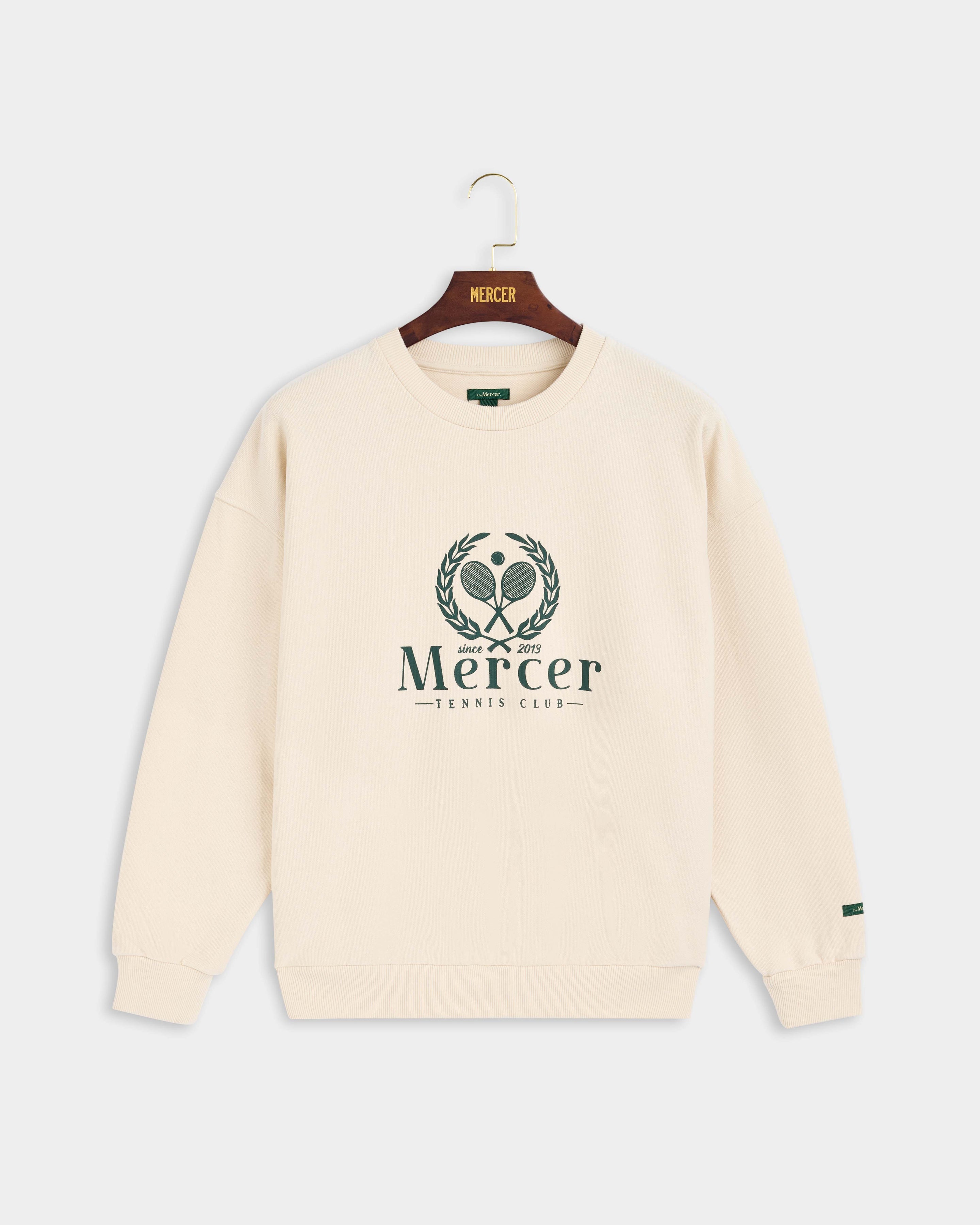 Product photo of the front of The Mercer Tennis Sweat in off white.